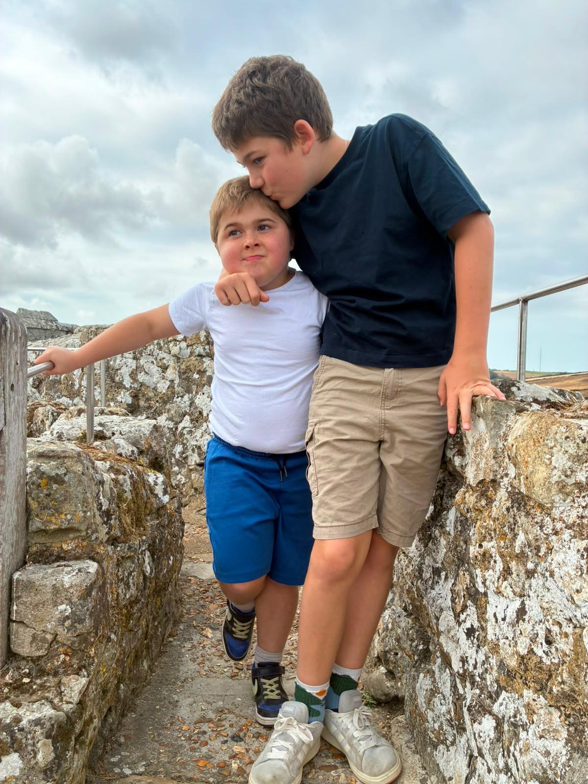 Two brothers sharing a hug on a Jumbulance trip