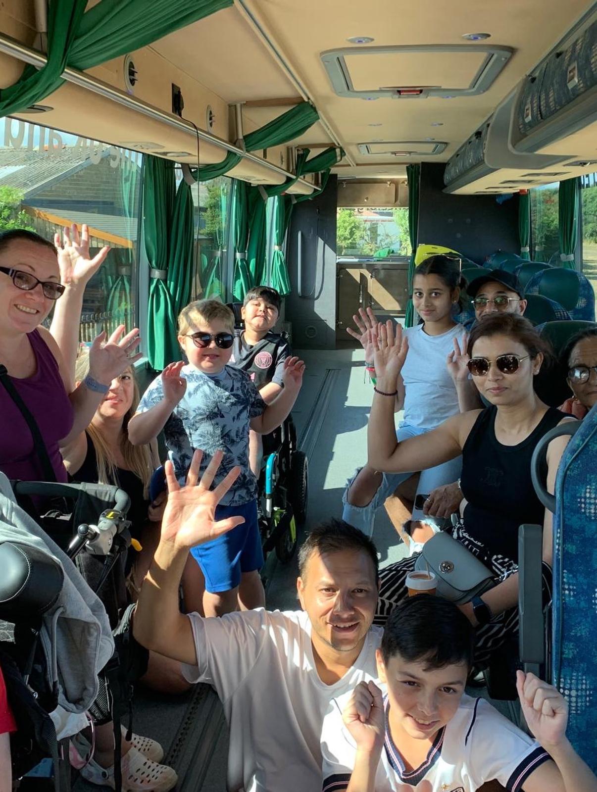 Waving hello aboard the Jumbulance coach